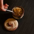 Chef Okay Inak plating Corti Soup in the Coupe Bowl and Lid Set during service at Sora Craft Kitchen restaurant