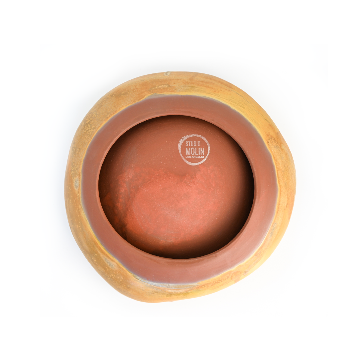 Bottom view of the Molin Bowl in matte ochre, showing the natural clay foot